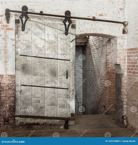 Sliding Heavy Industrial Metal Door In Old Warehouse Stock Image