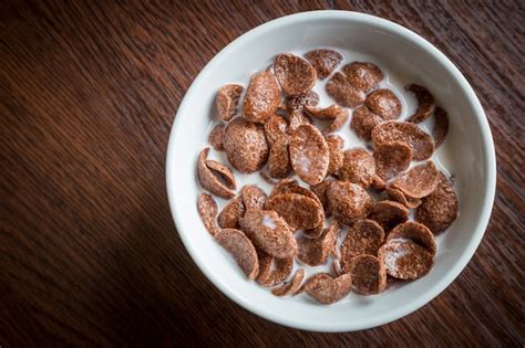 Premium Photo | Breakfast with chocolate cereal and milk.