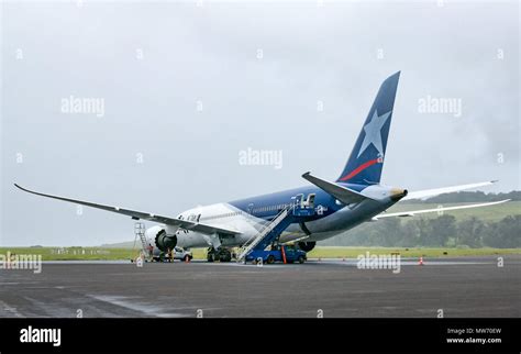 LATAM airline Dreamliner Boeing 787 on airport apron during rainy ...