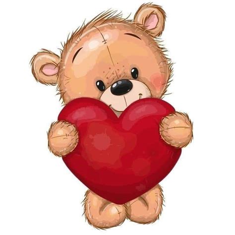 A Brown Teddy Bear Holding A Red Heart