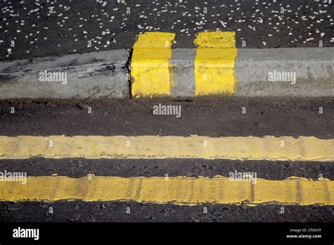 Double yellow parking loading restriction hi-res stock photography and ...