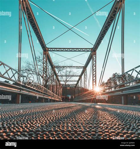 A low angle shot of the Little Walnut River Pratt Truss Bridge in Kansas wit sunrays Stock Photo ...