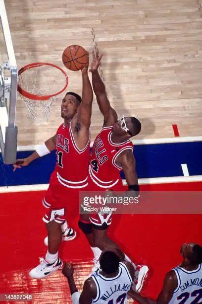 Stacy King And Horace Grant Of The Chicago Bulls Rebound Against The