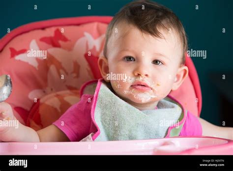 Messy Eating with Little Baby Stock Photo - Alamy