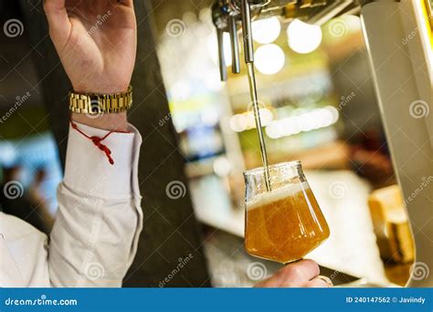 Crop Barman Pouring Beer In Glass In A Bar Stock Photo Image Of