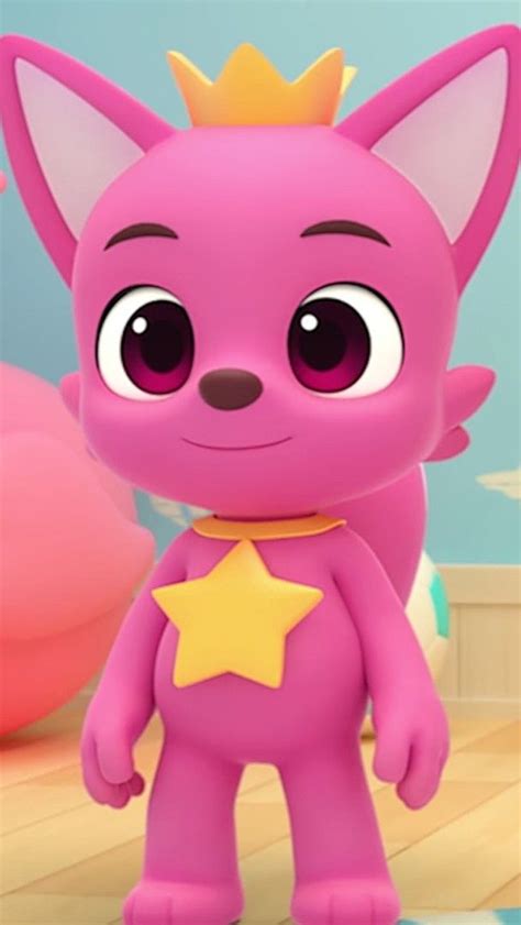 a pink cat with a gold star on its chest