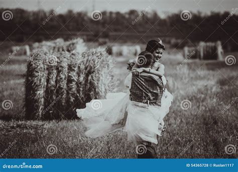 Bride And Groom Near Hay On A Rural Field Stock Photo Image Of Field