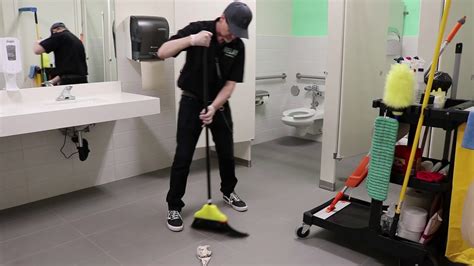 Janitor Cleaning Bathroom