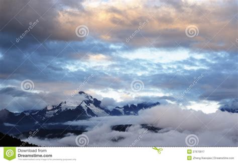 Snow mountain on sunrise stock image. Image of cloud - 27670917