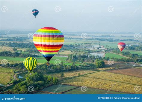 Hot Air Balloons Over Green Rice Field Stock Image Image Of Blue