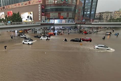 Severe flooding in Central China kills at least 12, traps subway riders ...