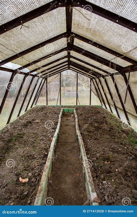 Rural Greenhouse with a Metal Frame Encompasses a Narrow Pathway Running through Its Soil Stock ...