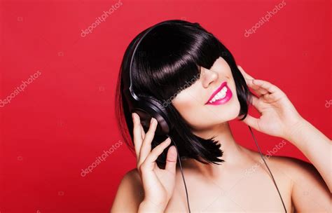 Woman Listening To Music On Headphones Enjoying A Dance Closeup