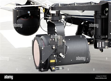 Police helicopter search light and camera pod Stock Photo - Alamy