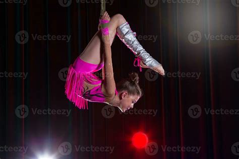 Circus artist acrobat performance. The girl performs acrobatic elements