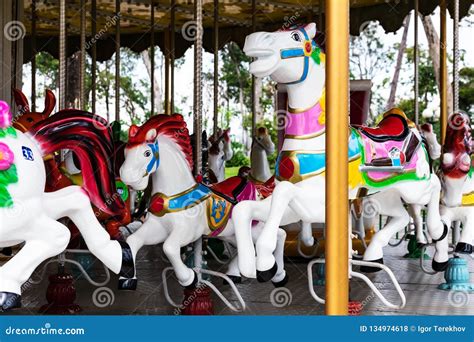 Horses On A Carnival Merry Go Round Stock Photo Image Of Delight