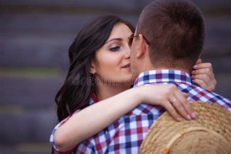 Happy girl hugging a guy stock image. Image of couple - 207672117