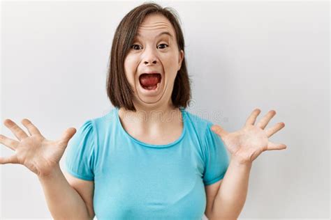 Young Down Syndrome Woman Standing Over Isolated Background Celebrating