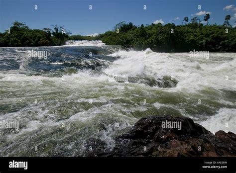 Africa Uganda Jinja Nile River flows over rapids at Bujagali Falls near ...