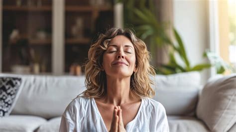 Premium Photo Middleaged Woman Meditating At Home With Eyes Closed