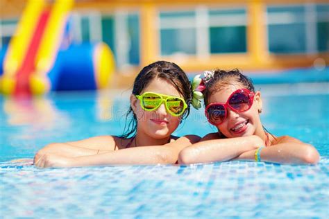 Happy Girl Friends Enjoy Swimming In The Pool Stock Image Image Of