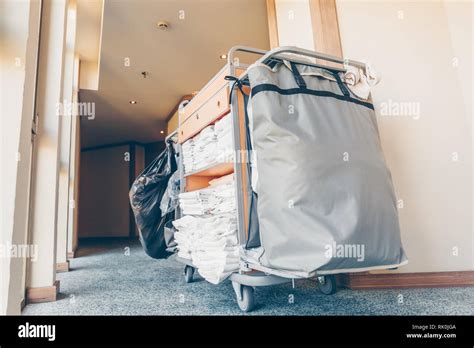 Housekeeping cart in the hotel corridor. Horizontal, light blue toning ...