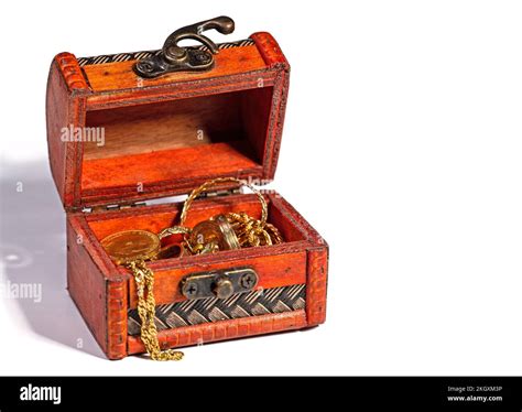 Wooden chest with gold jewelry against white background Stock Photo - Alamy