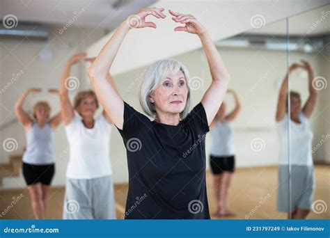 Portrait Of A Mature Woman Standing At The 5th Position Of The Ballet