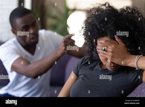 Tired African Wife Ignoring Angry Black Husband Blaming Of Problems