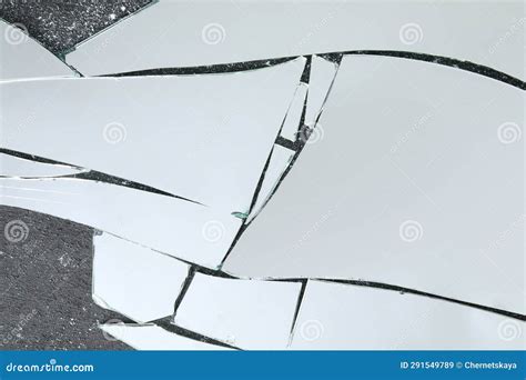 Shards Of Broken Mirror On Dark Textured Background Top View Stock