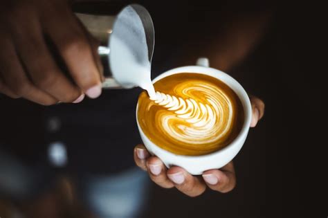 Premium Photo Barista Making A Cup Of Coffee Latte Art