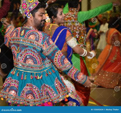 Girls Man Women Are Performing Garba And Dandiya Dance Wearing