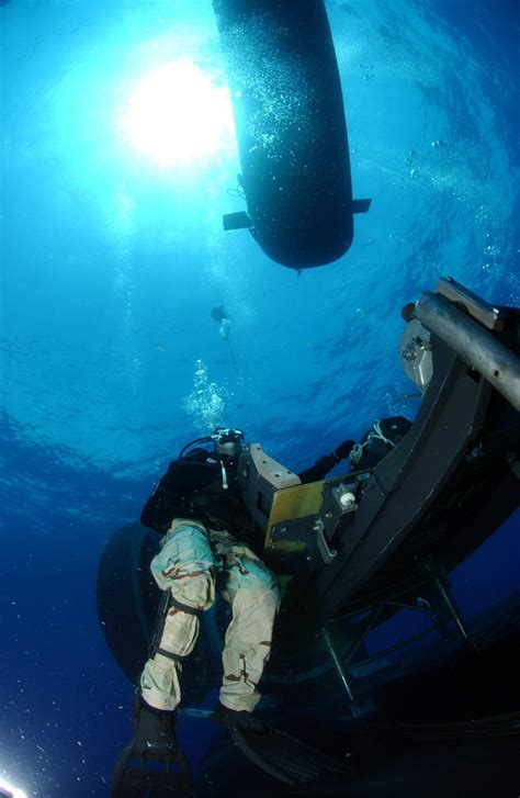 Off Key West Florida On 27 July 2007 A Navy Diver Stands By To Assist