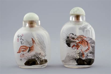 Two Chinese inside-painted glass snuff bottles with a cat and a tiger, 20th C. - Rob Michiels ...