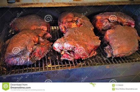 Smoking Pork Shoulders on a Traeger Pellet Smoker Stock Photo - Image of pulledpork, smoker ...