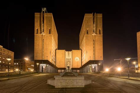 Oslo City Hall illuminated at night. It houses the city council, city ...