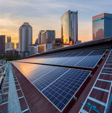 Solar Panel Photovoltaic Installation On A Roof Of Factory Photo