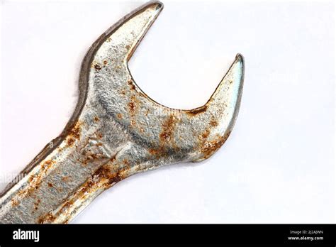 Close Up Of Used Rusty Spanner Isolated On White Background Stock Photo