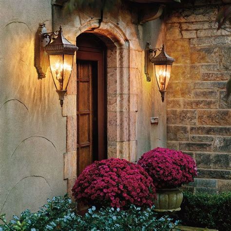 Two Outdoor Lanterns Flanking An Entry Door Add Elegance To This