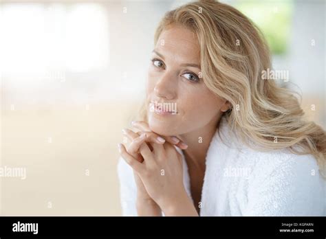 Portrait Of Beautiful 40 Year Old Woman Relaxing In Bathrobe At Home