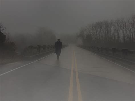 Premium Photo Man Walking On Road During Foggy Weather