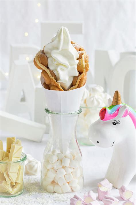 A Bubble Waffle With Frozen Yoghurt Next To A Unicorn Decoration