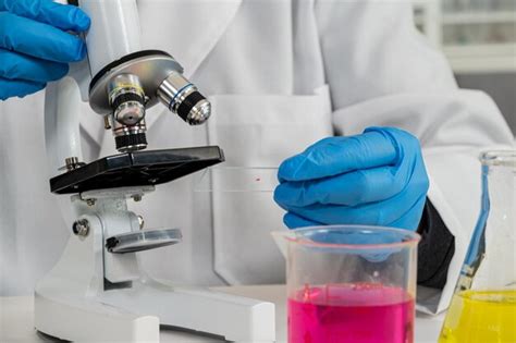 Premium Photo A Closeup Of A Scientists Hand Wearing Blue Gloves And