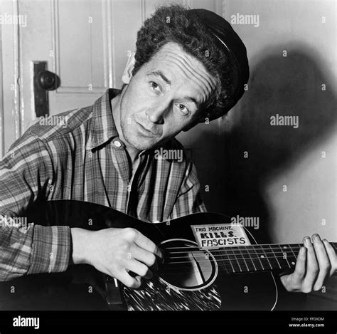 Woody Guthrie Namerican Folk Singer Photographed Playing