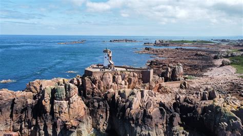 Lighthouse On Rocky Shore · Free Stock Photo