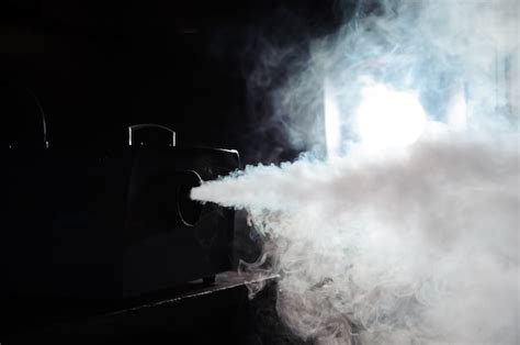 Premium Photo | Smoke machine in action lights in smoke