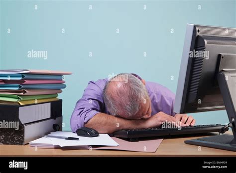 Overworked Man Sleeping At His Desk Stock Photo Royalty Free Image