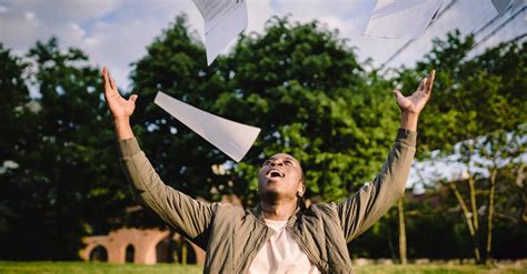 Happy Student Throwing Papers In Air In Park · Free Stock Photo