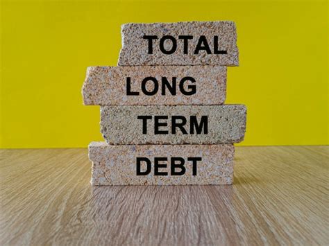 Premium Photo Total Long Term Debt Concept With Words On Brick Blocks