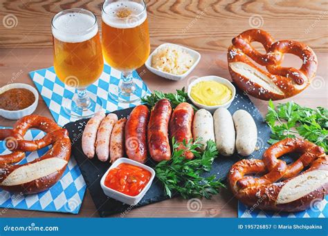 Oktoberfest Table with Traditional Food - Roasted Sausages, Pretzels ...